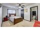Cozy bedroom featuring a wooden bed frame, and an ensuite half bathroom, ideal for peaceful rest and relaxation at 375 Tambec Nw Trce, Lilburn, GA 30047