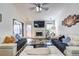 Spacious living room with vaulted ceilings, a fireplace, and lots of seating at 375 Tambec Nw Trce, Lilburn, GA 30047