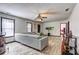 Spacious living room with hardwood floors, fan, and neutral paint, perfect for comfortable living and entertaining at 375 Tambec Nw Trce, Lilburn, GA 30047