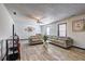 Spacious living room with modern furnishings, ceiling fan and wood-look floors at 375 Tambec Nw Trce, Lilburn, GA 30047
