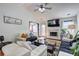 Bright living room with vaulted ceilings, fireplace, and door to outdoor space at 375 Tambec Nw Trce, Lilburn, GA 30047