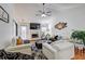Open living room with high ceilings, fireplace, and ample seating area at 375 Tambec Nw Trce, Lilburn, GA 30047