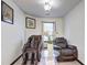 Cozy living room featuring two recliners, a glass table, and neutral decor at 375 Tambec Nw Trce, Lilburn, GA 30047