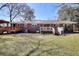 Large backyard with wooden deck and patio, perfect for outdoor entertaining at 4212 Logan Dr, Loganville, GA 30052