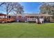 Expansive backyard featuring a wooden deck and plenty of green space at 4212 Logan Dr, Loganville, GA 30052