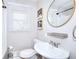 Cozy bathroom featuring a new sink and a window at 4212 Logan Dr, Loganville, GA 30052