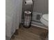 Close up view of toilet paper holder and toilet at 4212 Logan Dr, Loganville, GA 30052