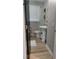 Powder room with a pedestal sink, modern fixtures, wood-look floors, and updated lighting at 4212 Logan Dr, Loganville, GA 30052