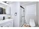 Stylish bathroom featuring a glass-enclosed shower, modern fixtures, and a sleek vanity at 4212 Logan Dr, Loganville, GA 30052