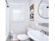 Cozy bathroom featuring a new sink and a window at 4212 Logan Dr, Loganville, GA 30052