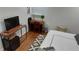 Bedroom featuring a work desk area, hardwood floors, natural light, and a cozy aesthetic at 4212 Logan Dr, Loganville, GA 30052