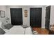 Bedroom showing updated closet doors, hardwood floors, and ample space for comfortable living at 4212 Logan Dr, Loganville, GA 30052