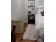 Bright bedroom featuring hardwood floors, a cozy rug, and charming decor at 4212 Logan Dr, Loganville, GA 30052