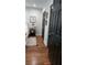 Bedroom featuring hardwood floors, closet doors, and neutral décor, creating a serene atmosphere at 4212 Logan Dr, Loganville, GA 30052