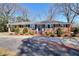 Attractive brick ranch with manicured landscaping and covered parking at 4212 Logan Dr, Loganville, GA 30052