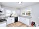 Bright kitchen features granite countertops, new appliances, and hardwood flooring at 4212 Logan Dr, Loganville, GA 30052