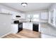 Bright kitchen features granite countertops, new appliances, and hardwood flooring at 4212 Logan Dr, Loganville, GA 30052