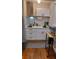 Modern kitchen with black accents, stainless steel appliances, and white cabinets at 4212 Logan Dr, Loganville, GA 30052
