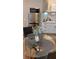 Compact kitchenette with stainless steel appliances and sleek white cabinets at 4212 Logan Dr, Loganville, GA 30052