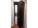 Laundry closet featuring a stacked washer and dryer hidden behind black folding doors at 4212 Logan Dr, Loganville, GA 30052