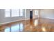 Bright living room with hardwood floors and multiple windows at 4212 Logan Dr, Loganville, GA 30052