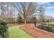 An inviting backyard with manicured landscaping, lush greenery, and a serene ambiance at 4850 Kentwood Dr, Marietta, GA 30068