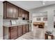 Basement wet bar area with dark cabinetry, granite countertops, and recessed lighting at 4850 Kentwood Dr, Marietta, GA 30068