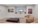 Basement entertainment area with comfortable seating, built-in cabinets, and a large screen television at 4850 Kentwood Dr, Marietta, GA 30068