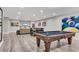 Finished basement with a pool table, dining area, and a comfortable seating area at 4850 Kentwood Dr, Marietta, GA 30068