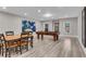 Finished basement featuring a pool table, dining table, neutral walls, and light wood-style flooring at 4850 Kentwood Dr, Marietta, GA 30068