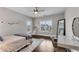 Cozy bedroom featuring large windows with street views, a decorative chair and rug, and a stylish desk setup at 4850 Kentwood Dr, Marietta, GA 30068