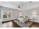 Bright bedroom with a ceiling fan, a plush rug, dark hardwood floors, and a large window at 4850 Kentwood Dr, Marietta, GA 30068