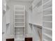 A well-designed closet with multiple shelves, wire basket drawers and hanging rods provides organized and accessible storage at 4850 Kentwood Dr, Marietta, GA 30068