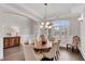 Elegant dining room featuring wainscoting and a modern chandelier at 4850 Kentwood Dr, Marietta, GA 30068