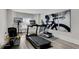 Basement exercise room featuring a treadmill, elliptical machine, rowing machine, and a TV at 4850 Kentwood Dr, Marietta, GA 30068