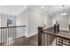 Hallway with wood banister and gleaming hardwood floors at 4850 Kentwood Dr, Marietta, GA 30068