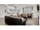 Bright living room featuring hardwood floors, fireplace, and an open layout into the kitchen area at 4850 Kentwood Dr, Marietta, GA 30068