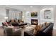 Cozy living room featuring a fireplace, built-in shelves, and comfortable seating arrangements at 4850 Kentwood Dr, Marietta, GA 30068