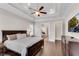 The main bedroom has a tray ceiling, hardwood flooring and leads to an ensuite bathroom at 4850 Kentwood Dr, Marietta, GA 30068