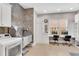 Spacious mud room features a dog wash station, laundry appliances, and a built-in desk with two computer monitors at 4850 Kentwood Dr, Marietta, GA 30068