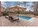 Outdoor oasis with a private pool, lounge chairs, and umbrella for relaxation at 4850 Kentwood Dr, Marietta, GA 30068