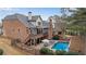 Spacious backyard with a pool, patio, deck, and manicured landscaping perfect for outdoor living at 4850 Kentwood Dr, Marietta, GA 30068