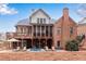 A beautiful two-story brick home featuring a spacious deck, screened porch, and an inviting backyard at 4850 Kentwood Dr, Marietta, GA 30068