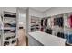 Spacious walk-in closet with custom shelves and drawers, providing ample storage space and organization for clothing and accessories at 4850 Kentwood Dr, Marietta, GA 30068