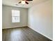 Cozy bedroom featuring durable vinyl floors and a bright, sunny window at 2199 Ramblewood Cir, Decatur, GA 30035