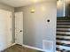 Entryway featuring gray walls, modern thermostat, and vinyl floors at 2199 Ramblewood Cir, Decatur, GA 30035