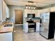 Modern kitchen boasts stainless steel appliances and butcher block countertops at 2199 Ramblewood Cir, Decatur, GA 30035