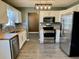 Modern kitchen boasts stainless steel appliances and butcher block countertops at 2199 Ramblewood Cir, Decatur, GA 30035