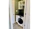 Convenient laundry area features a washer, storage, and overhead shelves at 2199 Ramblewood Cir, Decatur, GA 30035