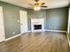 Spacious living room features a fireplace, modern ceiling fan, and neutral walls at 2199 Ramblewood Cir, Decatur, GA 30035